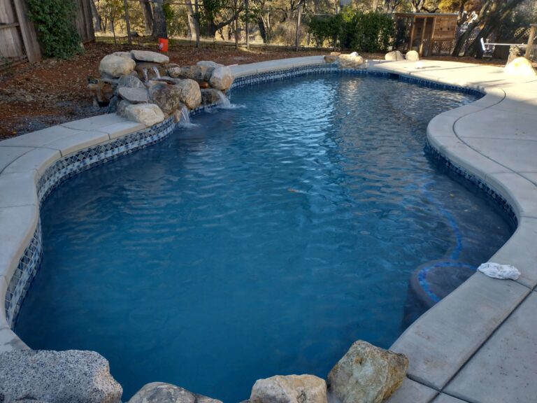 freeform pool with natural rock water feature
