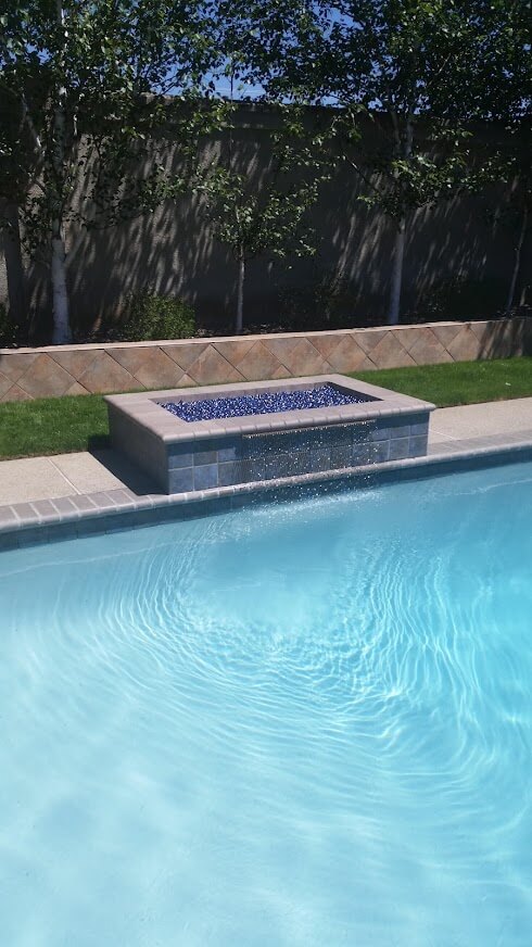 Pool with firepit feature